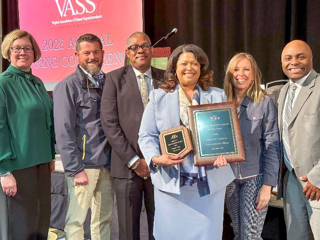 Dr. White standing with her Core Leadership team after being named Superintendent of the Year