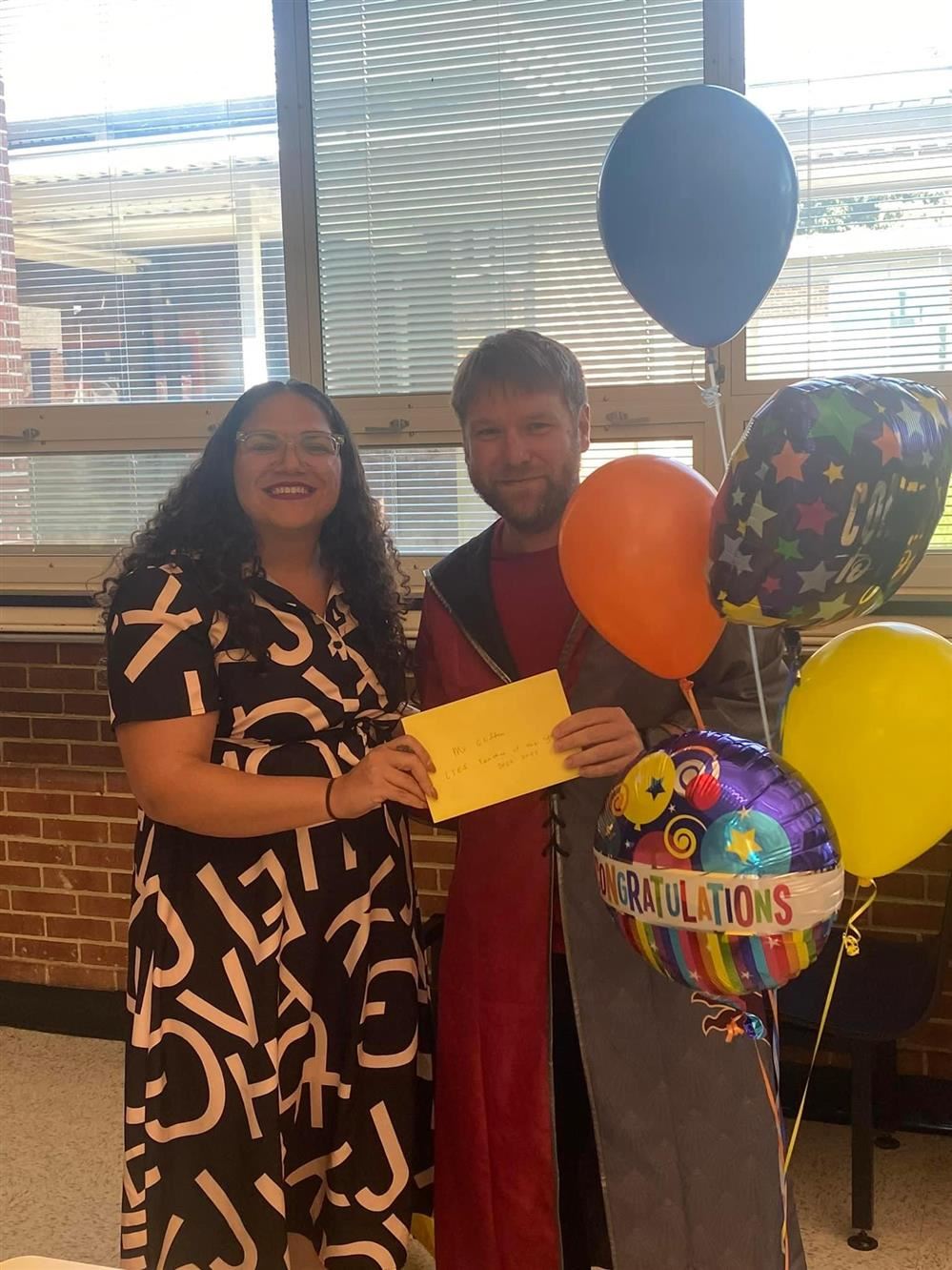  A picture of our Principal, Mrs. Mills and our Teacher of the Year, Mr. Clifton