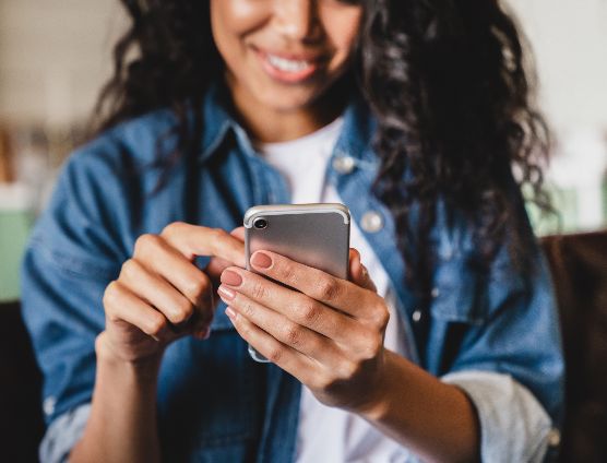  Woman smiling at phone