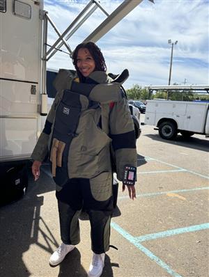 Student trying on gear