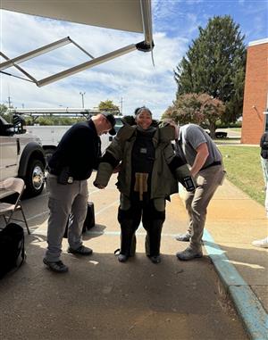 Student trying on gear