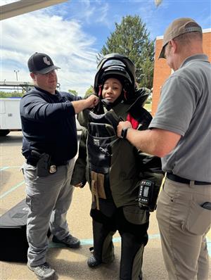 Student trying on gear