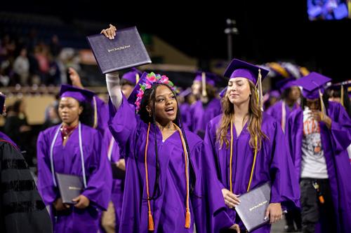 Student holding diploma