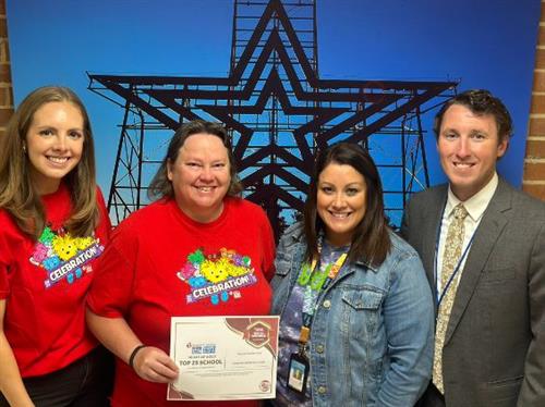  Round Hill administrators and teachers with their award