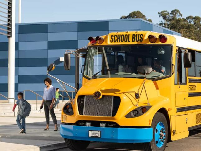  A Zum school bus drops students off.