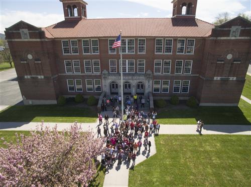 Forest Park from the air, with students standing outside.