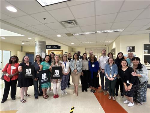 Volunteers with the EL Parent/Guardian University pose for a photo in the spring of 2023.