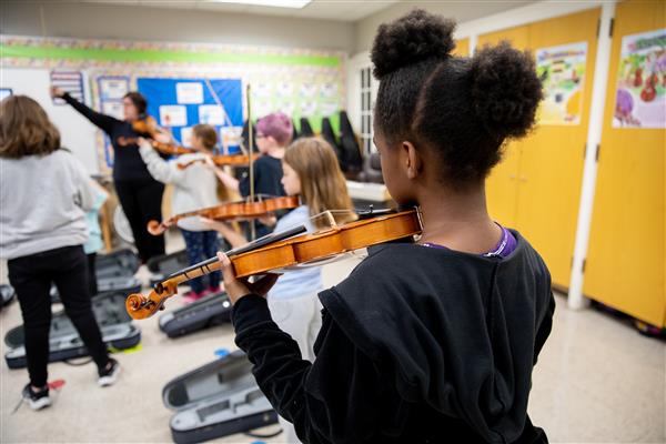 Student playing the viola